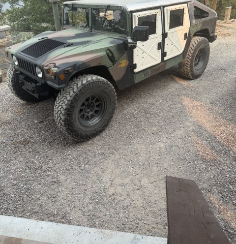 Woodland-camo Humvee H1 parked in Montana
