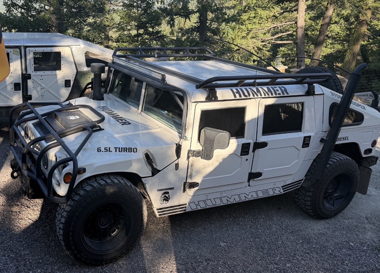 White Hummer H1 Stormtrooper build parked in the Montana pines